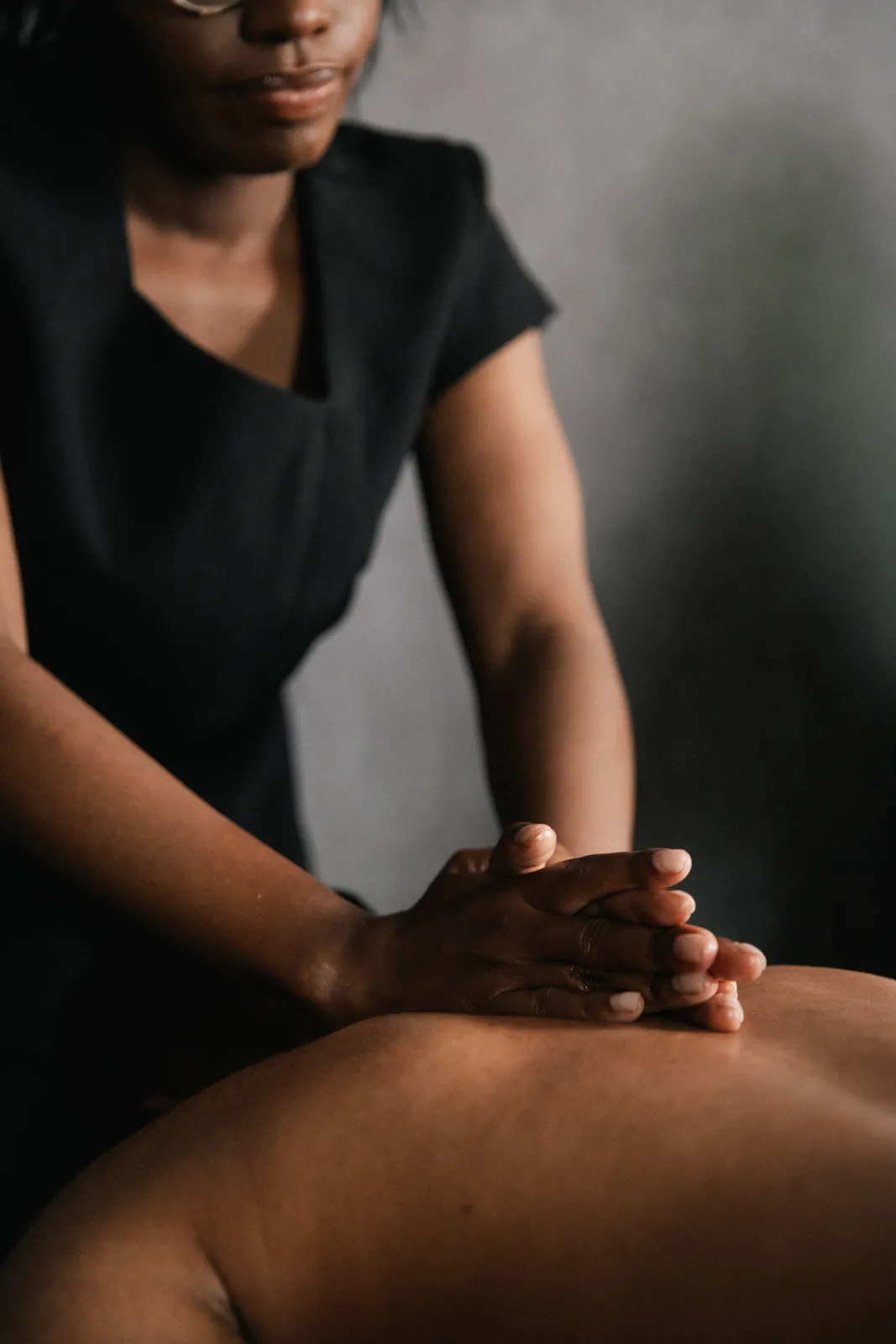 A therapist’s hands during a back massage